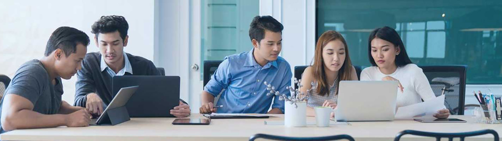 Co-workers looking at a laptop